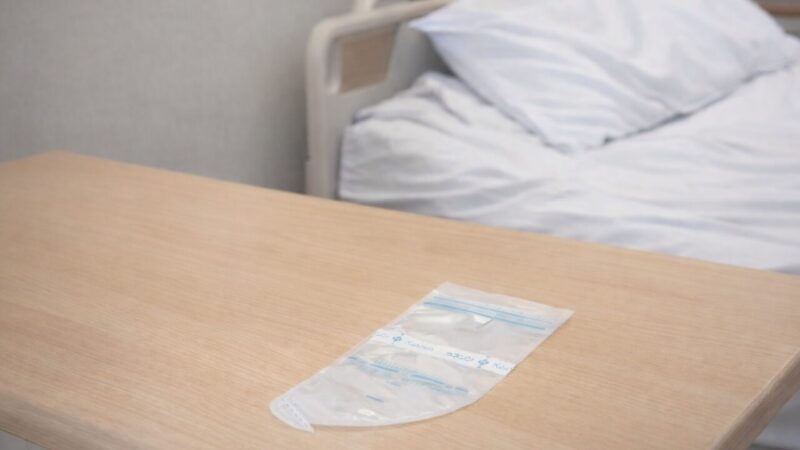 Breast milk storage bag placed on a hospital bedside table
